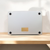 Laptop on a wooden surface with a blurred background