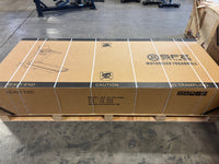 Large cardboard box with SRE branding on a concrete floor