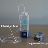 Clear and blue device with inhalation tube and supplement storage on a wooden surface.