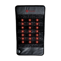 Infrared heating pad with visible red light bulbs on a white background