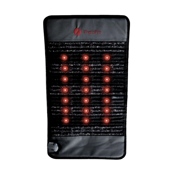 Infrared heating pad with visible red light bulbs on a white background