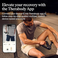 Man using a Therabody device with a smartphone displaying the app interface.