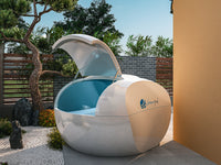 Portable hot tub with a lid in an outdoor setting