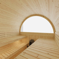 Wooden sauna interior with a large arched window