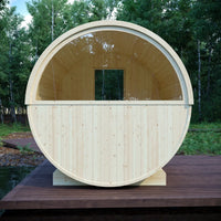 Wooden barrel-shaped structure on a wooden platform with a forest background