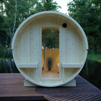 Wooden barrel-shaped structure with a door in a natural setting
