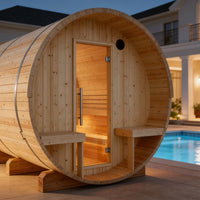 Wooden barrel-shaped sauna by a poolside with a house in the background