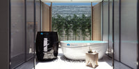 Modern bathroom with a bathtub and air purifier near a window with a view of trees and sky.