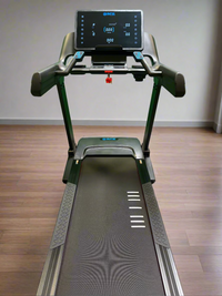 Treadmill with a digital display on a wooden floor