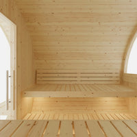 Wooden interior of a sauna with benches and arched windows.