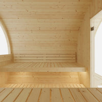 Wooden interior of a sauna with light wood paneling.