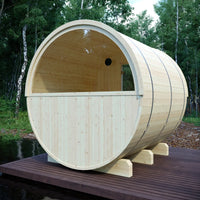 Wooden barrel-shaped structure on a wooden platform with trees in the background