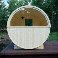 Wooden barrel-shaped structure on a wooden platform with trees in the background