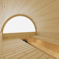 Wooden sauna interior with a large arched window.