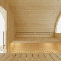 Wooden interior of a sauna with light wood paneling.