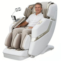 Man sitting in a modern massage chair with a white background