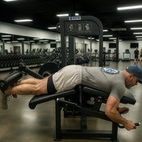 Man exercising on a leg press machine in a gym setting