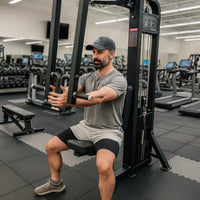 Man exercising on a gym machine in a fitness center