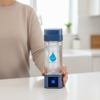 TheraH2Go+ water bottle held by a person in a kitchen setting